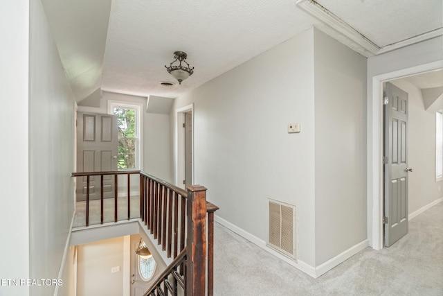 2115 Aaron Ct, Sevierville, TN 37876 - corridor with an upstairs landing, carpet, and a textured ceiling