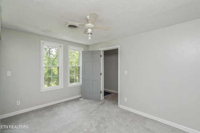 2115 Aaron Ct, Sevierville, TN 37876 - unfurnished bedroom with carpet flooring, a textured ceiling, and ceiling fan