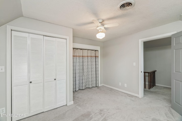 2115 Aaron Ct, Sevierville, TN 37876 - unfurnished bedroom featuring carpet floors, a closet, a ceiling fan, and a textured ceiling
