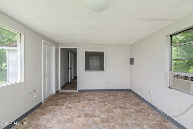2115 Aaron Ct, Sevierville, TN 37876 - spare room with plenty of natural light, stone finish floors, and a textured ceiling