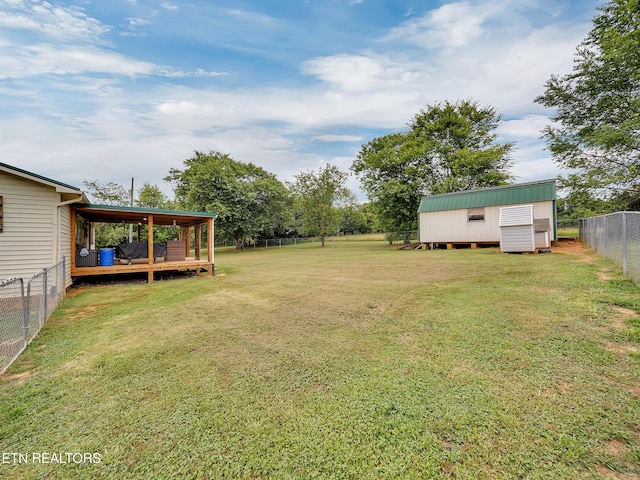1371 Elijah Martin Rd, Whitesburg, TN 37891 - fenced backyard featuring a deck and a storage unit