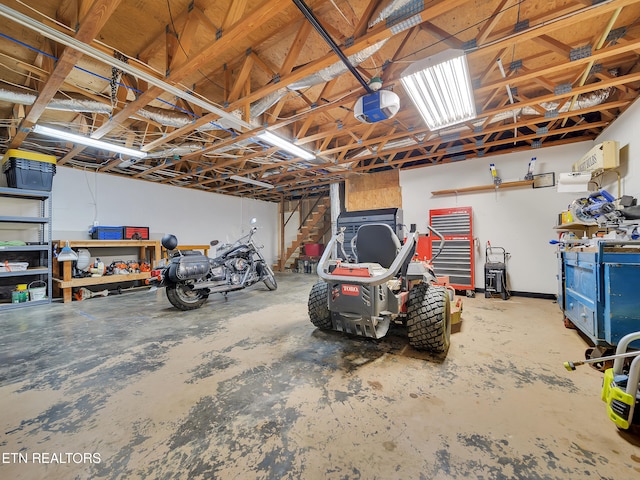 1371 Elijah Martin Rd, Whitesburg, TN 37891 - garage featuring a workshop area and a garage door opener