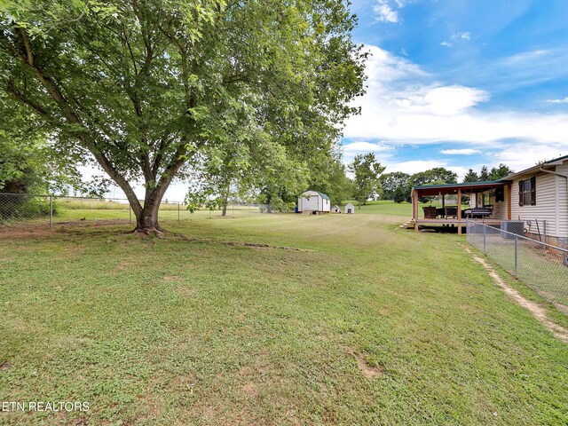 1371 Elijah Martin Rd, Whitesburg, TN 37891 - fenced backyard featuring a shed and a carport