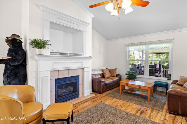 1903 Star Dust Way, Walland, TN 37886 - living room with lofted ceiling, crown molding, a ceiling fan, wood finished floors, and a fireplace