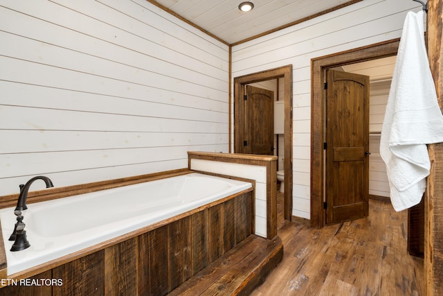 1023 Timberlake Cir, Sevierville, TN 37876 - full bathroom with a garden tub, hardwood / wood-style floors, wood walls, and wood ceiling
