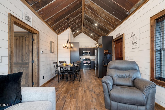 1023 Timberlake Cir, Sevierville, TN 37876 - living room featuring wooden walls, dark wood-style flooring, a chandelier, and wooden ceiling