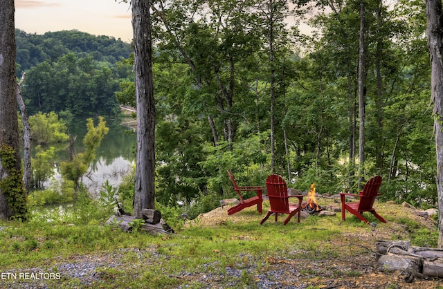 1023 Timberlake Cir, Sevierville, TN 37876 - view of yard with a fire pit and a view of trees