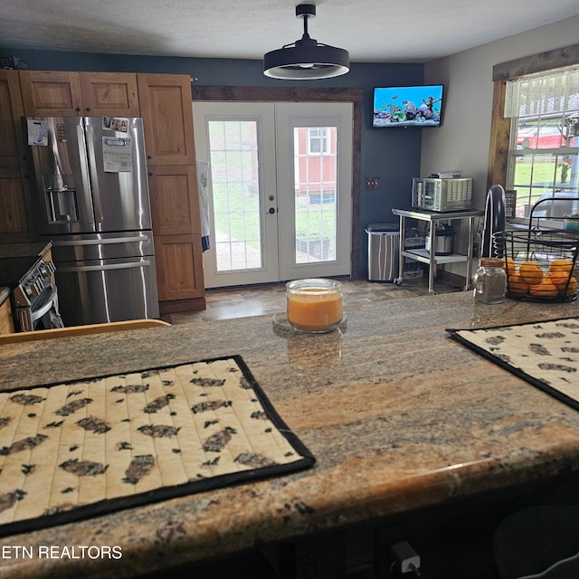 1100 Mill Branch Rd, Huntsville, TN 37756 - kitchen featuring appliances with stainless steel finishes, french doors, healthy amount of natural light, and brown cabinetry