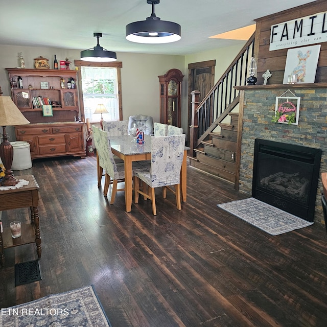 1100 Mill Branch Rd, Huntsville, TN 37756 - dining area with dark wood-type flooring, stairway, and a stone fireplace