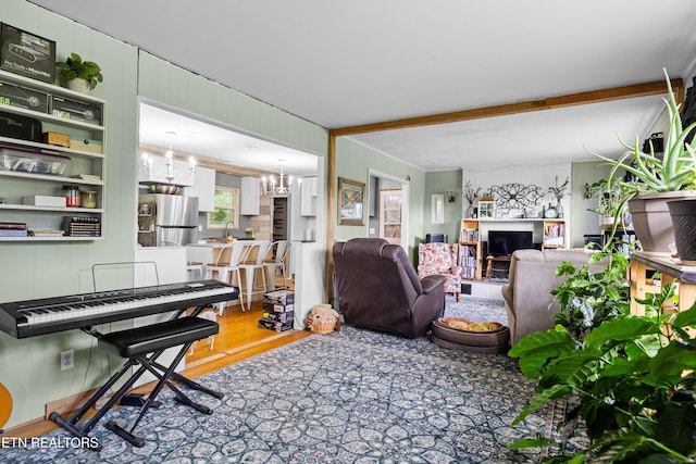 816 Thorn Grove Pike, Strawberry Plains, TN 37871 - living area featuring light wood-type flooring and a chandelier