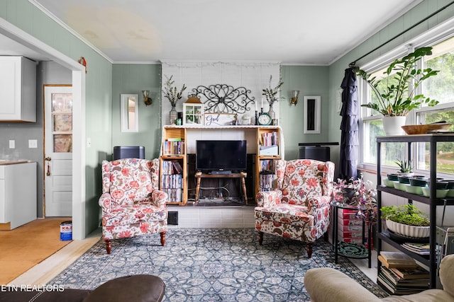 816 Thorn Grove Pike, Strawberry Plains, TN 37871 - living area featuring healthy amount of natural light, ornamental molding, and wood finished floors