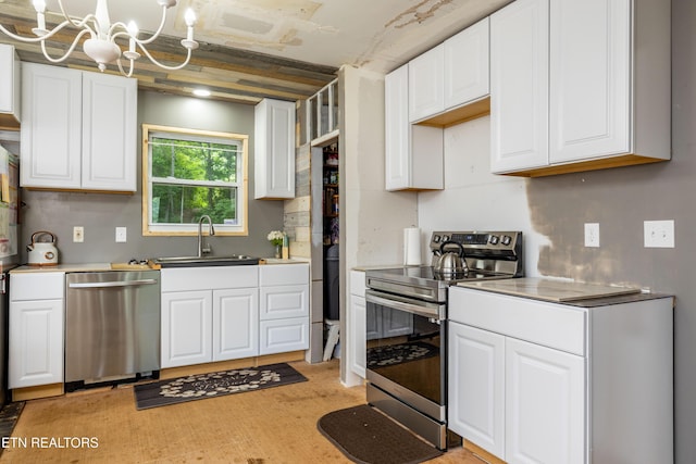 816 Thorn Grove Pike, Strawberry Plains, TN 37871 - kitchen featuring appliances with stainless steel finishes, white cabinets, a chandelier, and light countertops