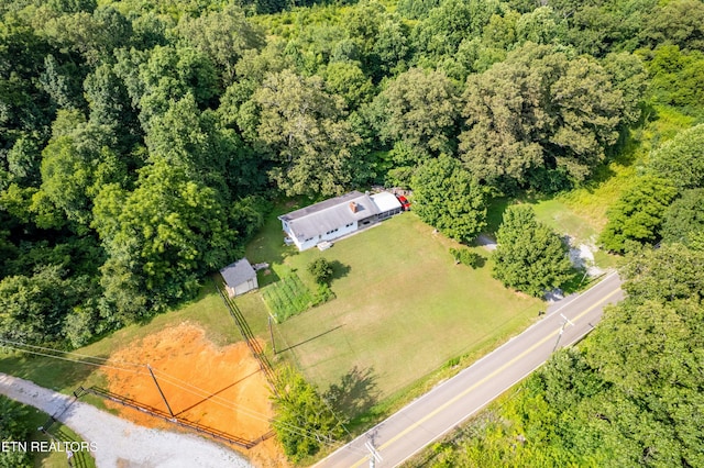 816 Thorn Grove Pike, Strawberry Plains, TN 37871 - aerial view of property and surrounding area featuring a heavily wooded area
