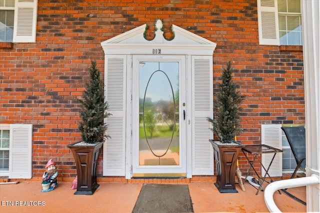 116 Oak St, Jacksboro, TN 37757 - view of exterior entry featuring brick siding