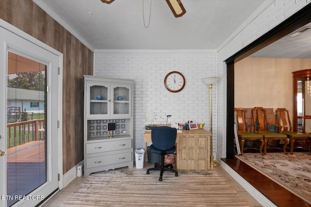116 Oak St, Jacksboro, TN 37757 - office space with brick wall, ornamental molding, ceiling fan, and light tile patterned flooring