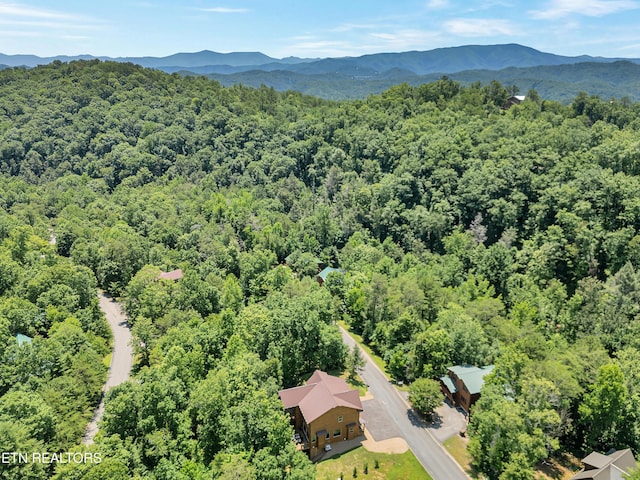 1940 Smoky Cove Rd, Sevierville, TN 37876 - drone / aerial view of a heavily wooded area and a mountainous background