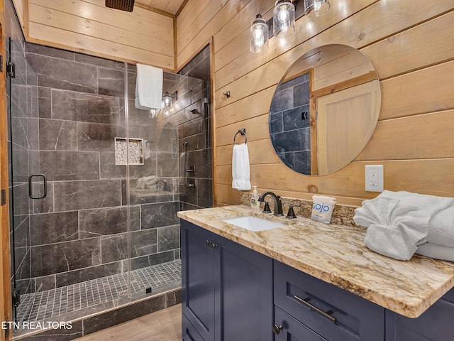 1940 Smoky Cove Rd, Sevierville, TN 37876 - full bathroom featuring vanity, a stall shower, and wood walls