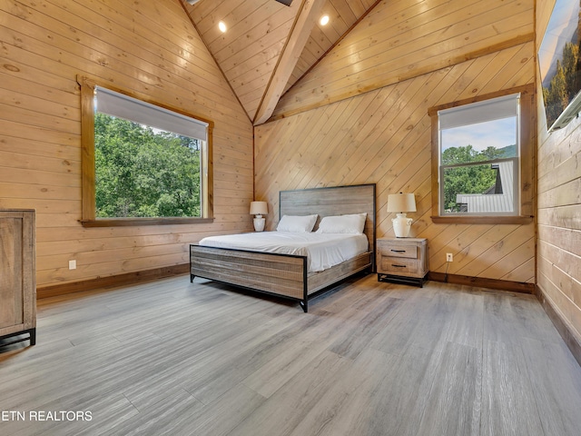 1940 Smoky Cove Rd, Sevierville, TN 37876 - bedroom with lofted ceiling, wooden walls, and wood finished floors