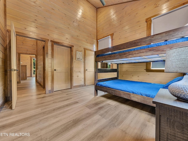 1940 Smoky Cove Rd, Sevierville, TN 37876 - bedroom with wood walls, a high ceiling, and wood finished floors