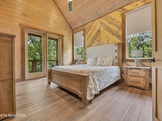 1940 Smoky Cove Rd, Sevierville, TN 37876 - bedroom with vaulted ceiling, wooden walls, light wood finished floors, and wood ceiling