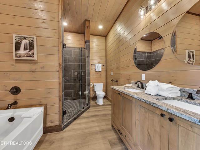 1940 Smoky Cove Rd, Sevierville, TN 37876 - full bath with wooden walls, double vanity, a stall shower, wood finished floors, and a garden tub