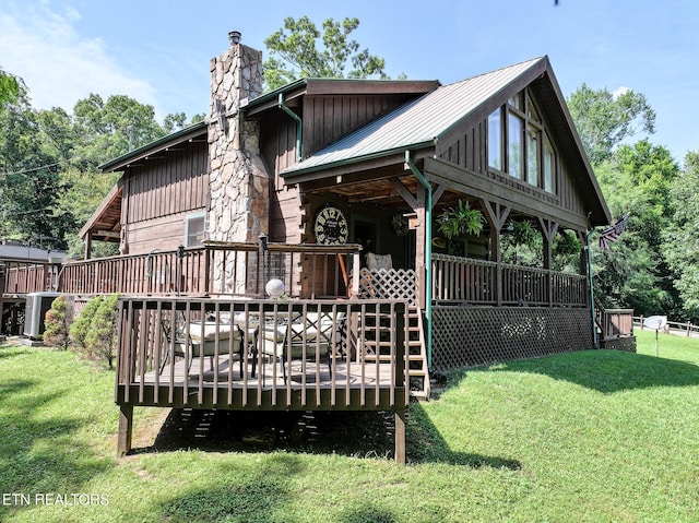 721 Leisure Way, Newport, TN 37821 - back of property with a chimney, a lawn, a metal roof, and board and batten siding
