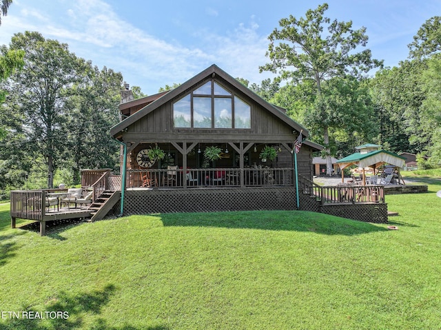 721 Leisure Way, Newport, TN 37821 - rear view of property with a chimney, a wooden deck, a lawn, and view of wooded area