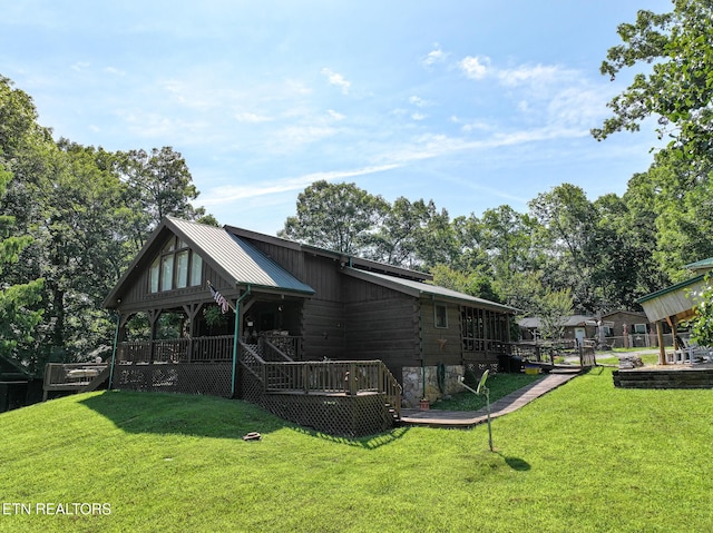 721 Leisure Way, Newport, TN 37821 - rear view of house featuring a yard, a wooden deck, and a metal roof