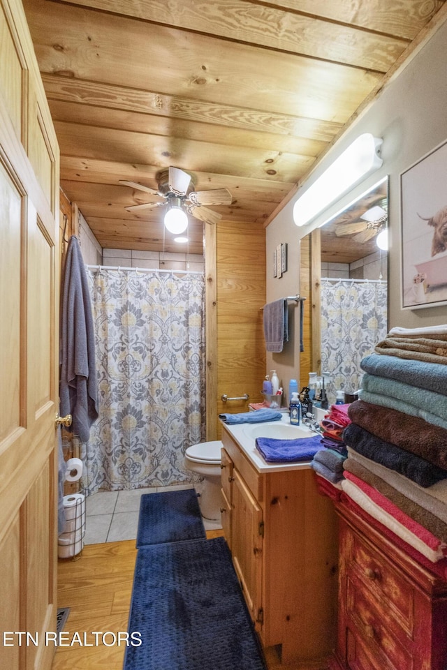 721 Leisure Way, Newport, TN 37821 - bathroom featuring vanity, a ceiling fan, wood finished floors, a shower with shower curtain, and wood walls