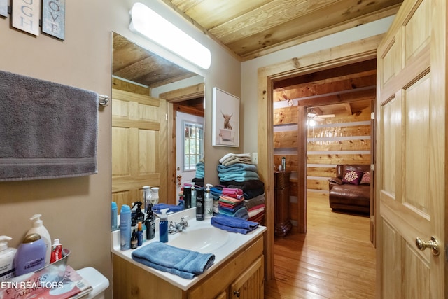 721 Leisure Way, Newport, TN 37821 - half bathroom with vanity and hardwood / wood-style floors