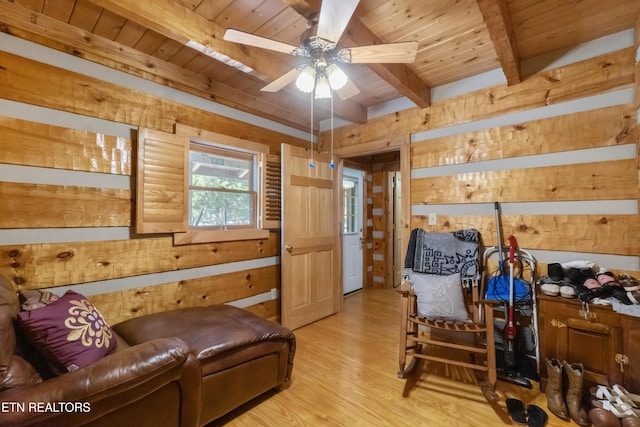721 Leisure Way, Newport, TN 37821 - living area with a wooden ceiling with exposed beams, light wood-style floors, ceiling fan, and wooden walls