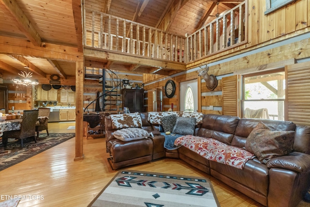 721 Leisure Way, Newport, TN 37821 - living area featuring a wooden ceiling with exposed beams, light wood-style flooring, stairway, a chandelier, and log walls