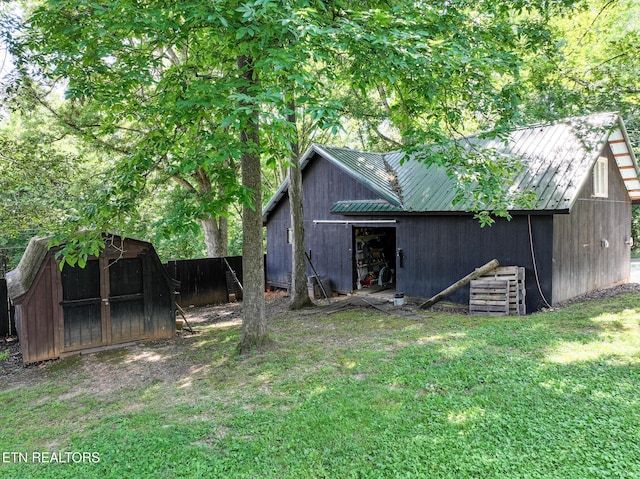 721 Leisure Way, Newport, TN 37821 - rear view of house with a metal roof and a shed