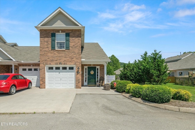 3701 Eliza Pointe Way, Knoxville, TN 37921 - traditional-style house featuring concrete driveway, brick siding, an attached garage, and a shingled roof