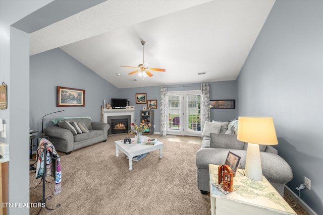 3701 Eliza Pointe Way, Knoxville, TN 37921 - living room with vaulted ceiling, a ceiling fan, carpet flooring, and a glass covered fireplace
