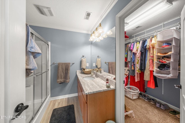 3701 Eliza Pointe Way, Knoxville, TN 37921 - bathroom featuring vanity, a shower stall, ornamental molding, and a walk in closet