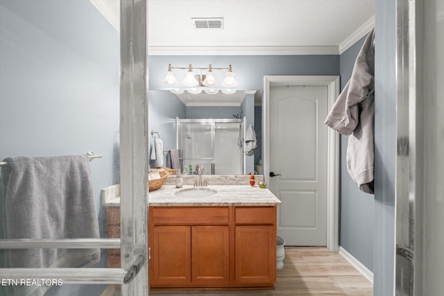3701 Eliza Pointe Way, Knoxville, TN 37921 - full bathroom with wood finished floors, vanity, crown molding, and a stall shower