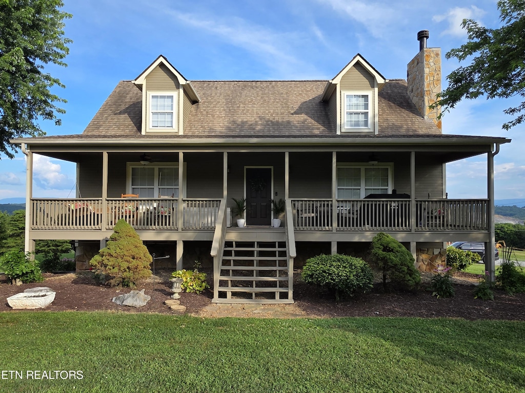401 Klondike Cir, Kodak, TN 37764 - view of front of home with a front lawn, a chimney, a porch, and stairway