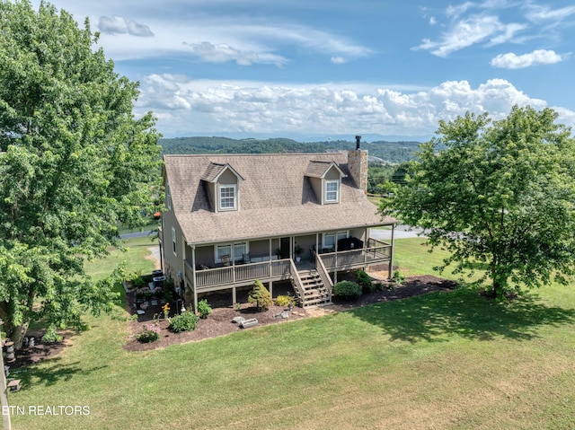 401 Klondike Cir, Kodak, TN 37764 - new england style home featuring a front lawn, covered porch, a chimney, stairway, and a shingled roof