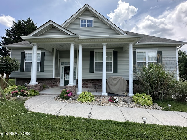 5843 Forest View Ln, Ooltewah, TN 37363 - neoclassical home with a porch and brick siding