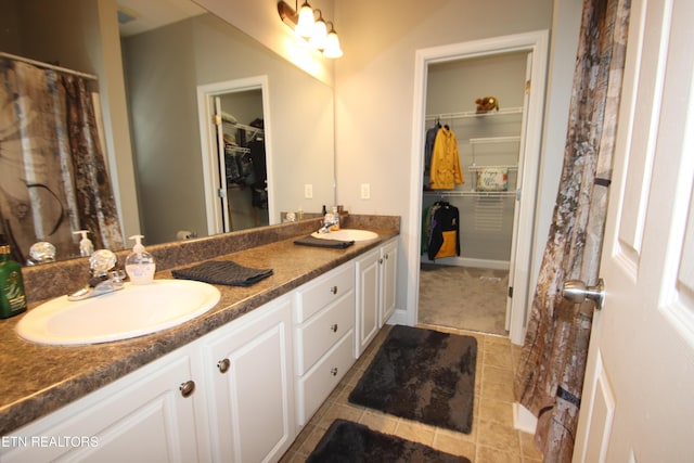 5843 Forest View Ln, Ooltewah, TN 37363 - full bathroom featuring double vanity, a walk in closet, and tile patterned flooring