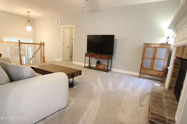 5843 Forest View Ln, Ooltewah, TN 37363 - living room with a fireplace, light carpet, and a ceiling fan