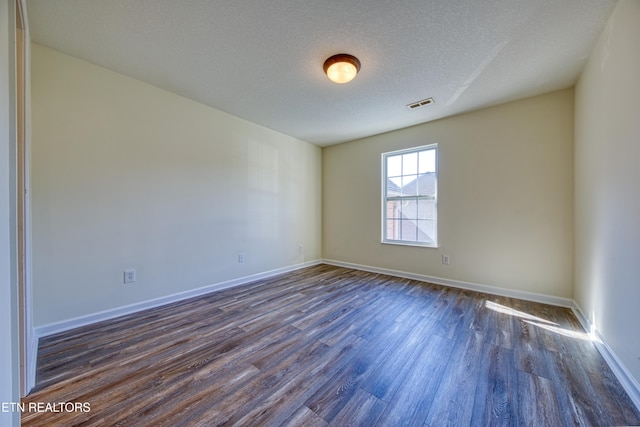 1709 Maple View Way Unit 4A, Knoxville, TN 37918 - unfurnished room featuring dark wood-type flooring and a textured ceiling