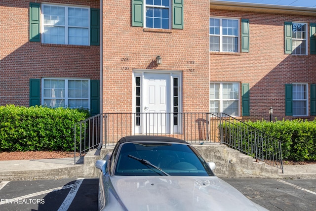 1709 Maple View Way Unit 4A, Knoxville, TN 37918 - view of exterior entry with brick siding and uncovered parking