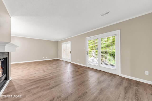 8707 Olde Colony Trl Unit 13, Knoxville, TN 37923 - unfurnished living room with a glass covered fireplace, wood finished floors, and crown molding