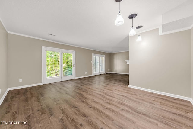 8707 Olde Colony Trl Unit 13, Knoxville, TN 37923 - unfurnished living room featuring crown molding and wood finished floors