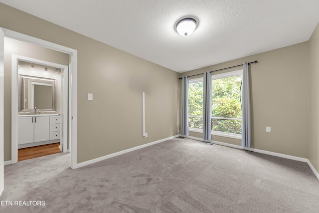 8707 Olde Colony Trl Unit 13, Knoxville, TN 37923 - carpeted empty room featuring a textured ceiling and baseboards
