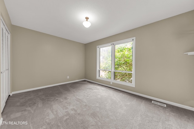 8707 Olde Colony Trl Unit 13, Knoxville, TN 37923 - unfurnished bedroom with a closet and carpet flooring