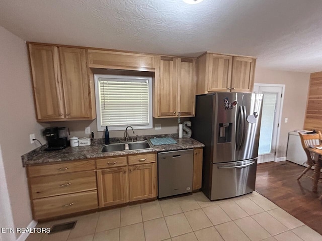 935 Pinetree Rd, Jamestown, TN 38556 - kitchen with appliances with stainless steel finishes, light tile patterned flooring, and a textured ceiling