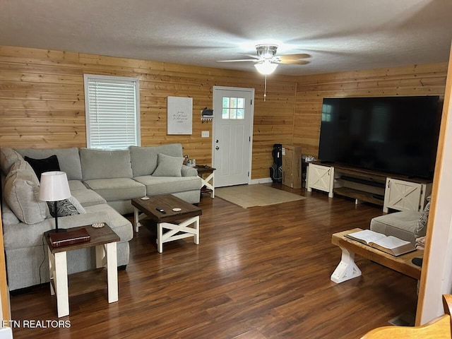 935 Pinetree Rd, Jamestown, TN 38556 - living room with wooden walls, a ceiling fan, and wood finished floors